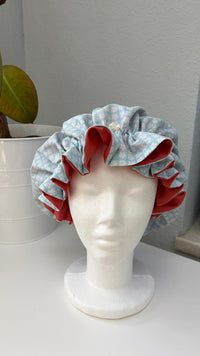 Bonnet Satin Blümchen blau aprico